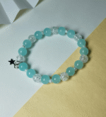 The Aqua Mist Crackle Star Bracelet is delicately handcrafted with crackle glass beads in a serene aqua mist shade