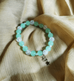 The Aqua Mist Crackle Star Bracelet is delicately handcrafted with crackle glass beads in a serene aqua mist shade